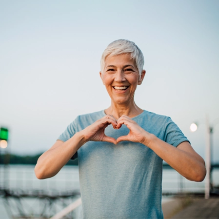 Chiropractic Firestone CO Lady Making Heart Hands